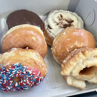 Bavarian crème filled, cinnamon roll, glazed, raspberry filled, sour cream glazed and 4th of July sprinkles!