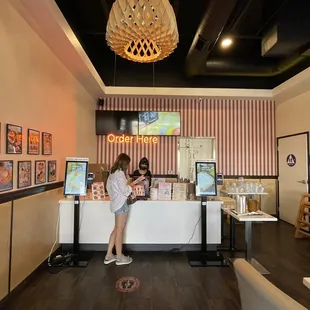 a woman and a child at the counter