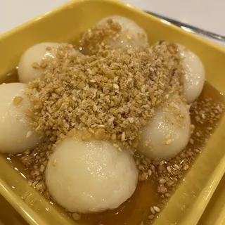 Glutinous Rice Balls with Crushed Peanut, Sesame, and Coconut Flakes
