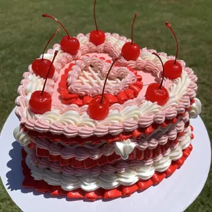 a cake with cherries on top