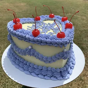 a cake with cherries on top