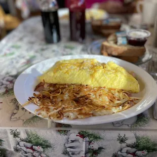H.M.C. Omelette. (Ham mushroom and cheese) and hashbrowns.