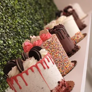 a row of decorated cakes