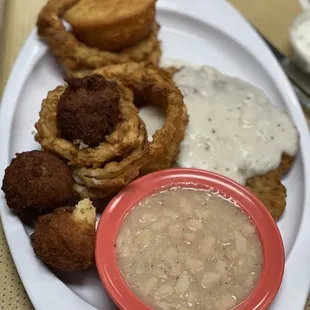 Chicken fried steak with white beans and onion rings