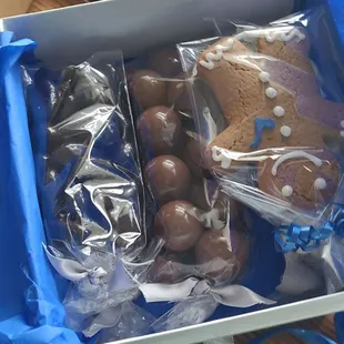 Dark chocolate covered almonds, giant malted milkballs,  non pareils and gingerbread boy