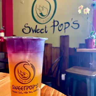 a drink in a plastic cup on a table