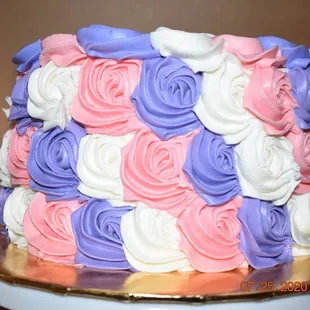 Strawberry Cake with colorful rosettes.