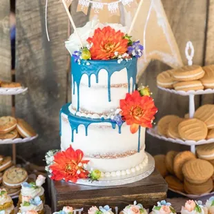 a wedding cake and cupcakes