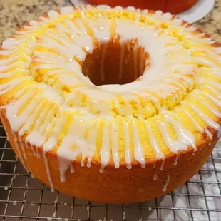a glazed cake on a cooling rack