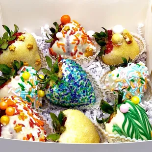 a box of decorated strawberries