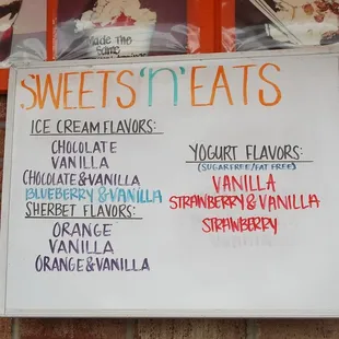 a menu on a brick wall