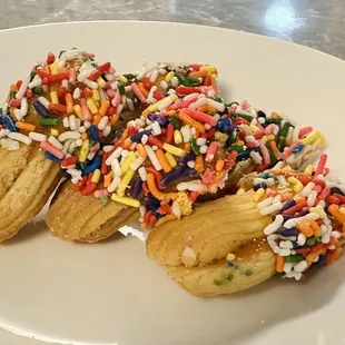 Apricot filled butter cookies with sprinkles.