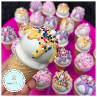 an ice cream cone with sprinkles
