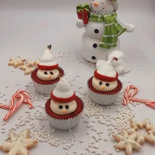 a group of cupcakes decorated like snowmen