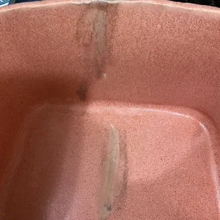 Finger marks from where they attempted to wipe off the wrong glaze.