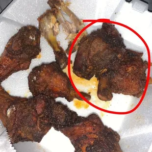 chicken wings in a styrofoam container