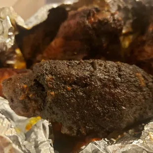 a piece of meat wrapped in tin foil