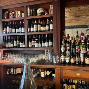 a bar with many bottles of wine