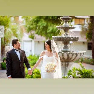 Our beautiful bride and groom in front of the newly added fountains.
