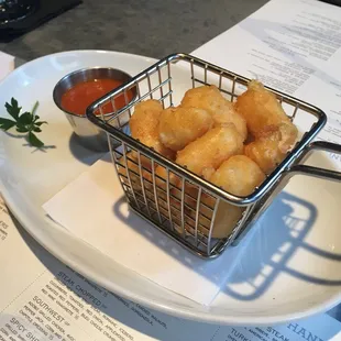 Cornmeal beer battered cheese curds.