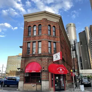 a red awning on a brick building