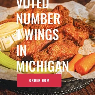 a plate of wings and carrots