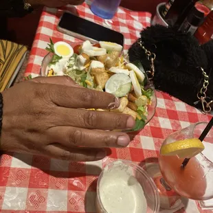 My friend is eating her salad with her hands