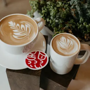two cups of coffee on a saucer