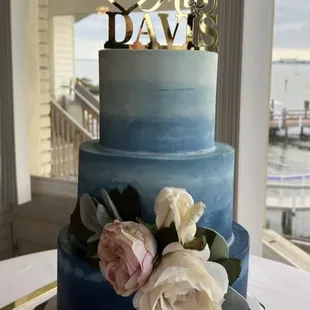 a wedding cake decorated with roses