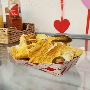 a basket of nachos on a counter