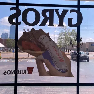 a hand holding a sandwich