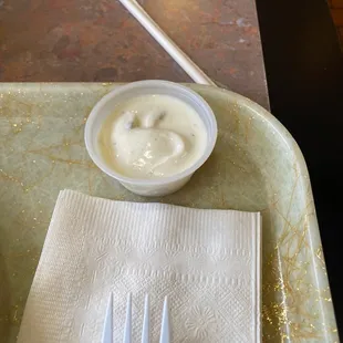 a bowl of yogurt and a fork