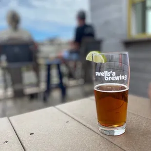 a glass of beer on a table