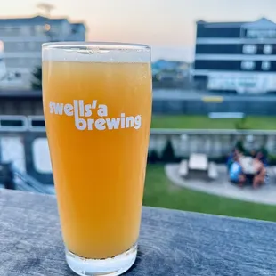 a glass of beer on a table