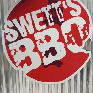 a red and white sign