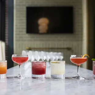 a variety of cocktails on a table