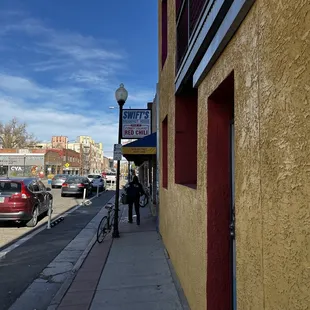 a person walking down the sidewalk