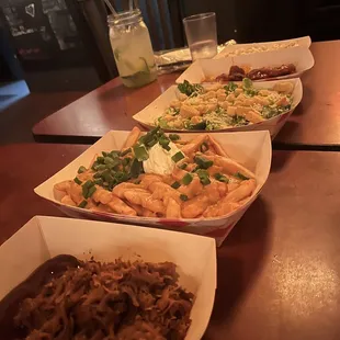 a row of plates of food on a table
