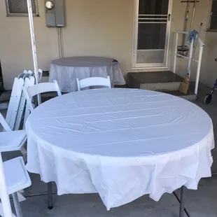 That's the 60 inch table in the foreground and the 48 inch table in the background. You can also see what the chairs look like.