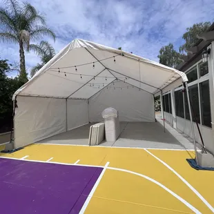 2 side coverings, tables, chairs, 20x20 canopy, string lights