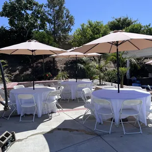 Tables, chairs, linens, umbrellas