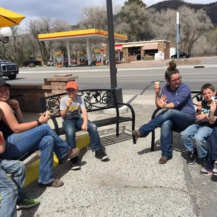 Kids and moms enjoying ice cream.