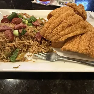 Fried fish with a side of the house rice with sausage added. Total cost with an ole fashioned $36