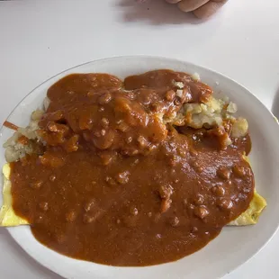 Cheese omelet smothered in red