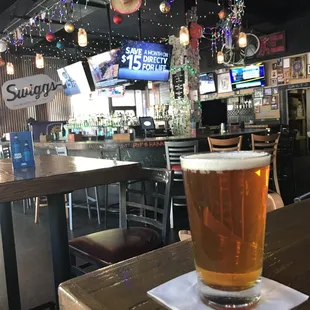a pint of beer on a table