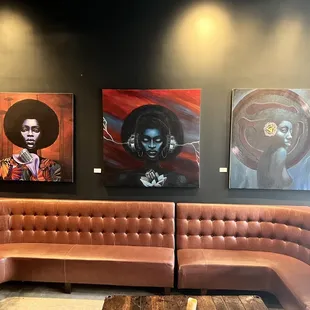 Artwork available for sale, and lounge seating.