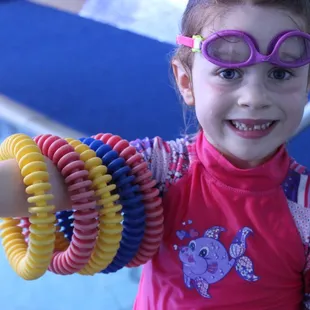 Diving rings are fun in the pool, as well as a fun fashion accessory!