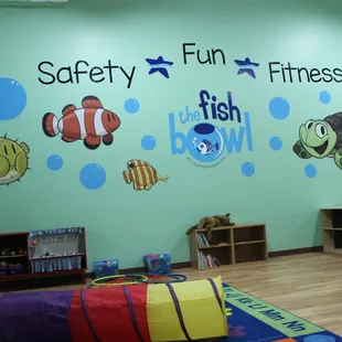 Enrolled families enjoy playtime before and after lessons in the FishBowl, our year-round indoor play space.