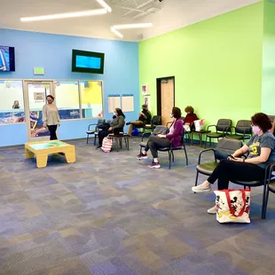 Social distancing in the lobby - only one parent attends their child's lesson.