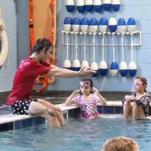 Teaching them Breast Stroke.